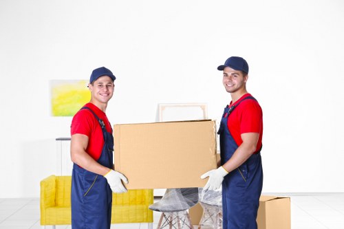 Trained removals staff handling boxes carefully
