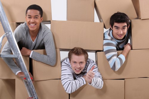 Commercial moving team organizing office equipment
