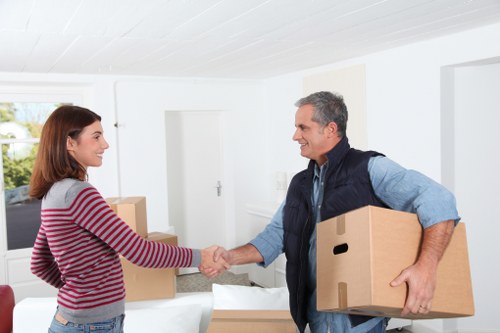 Man and van Waterloo moving household items into a van