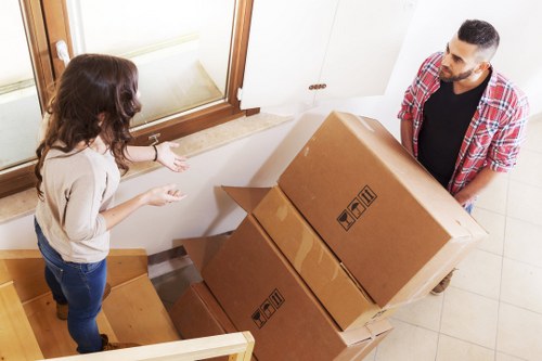 Professional movers carrying furniture during a Waterloo relocation